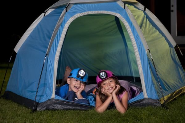 kids playing in a tent in the garden
