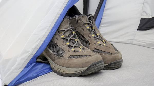 pair of hiking boots in a tent