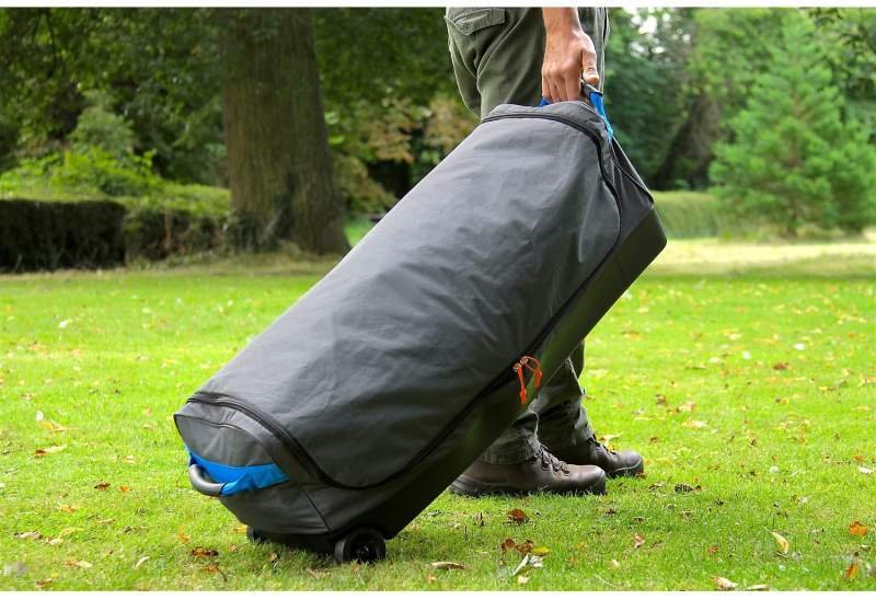 man walking with the Octagon tent carry bag